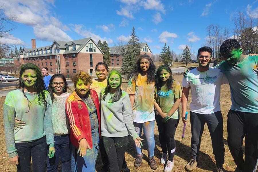 A diverse group of students after a color run